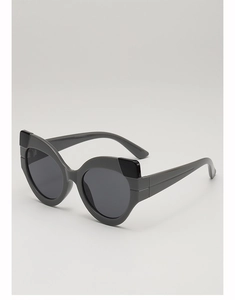 Detailed view of cat-eye sunglasses with geometric accents and dark gray lenses
