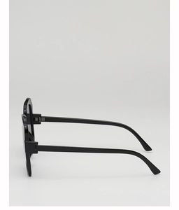 Side view of sleek black fashion sunglasses showing temple hinge and glossy frame details