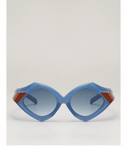 Detail of irregular geometric sunglasses with light blue frame and orange hinge accents