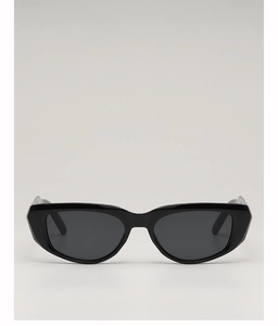 Detailed close-up of small cat-eye sunglasses with a black frame and dark grey lenses