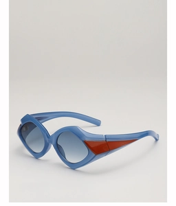 Detail view of morandi blue geometric sunglasses with bold orange triangle accents
