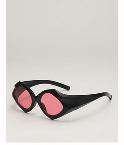 Detail of wide black geometric frame sunglasses with red lenses in a hip hop style