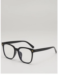 Detail of square black sunglasses frame featuring elegant gold metal hinge accents
