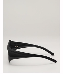 Detail view of bold matte black temple with metal hinge on geometric sunglasses