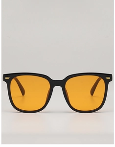 Detailed close-up of black square frame sunglasses with golden double bar metal accents