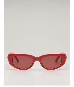 Detail view of stylish red geometric cat-eye sunglasses with polished synthetic frame