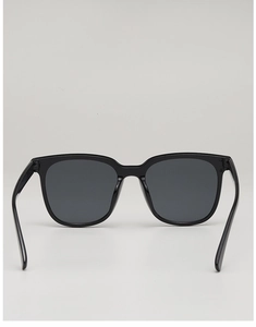 Detail view of the durable hinges and sleek frame of black square sunglasses