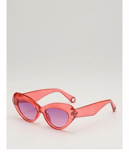 Detailed macro view of red translucent cat-eye frame with purple gradient lenses