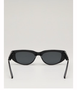 Detail view of the sleek black cat-eye sunglasses frame and smooth inner structure