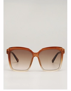 Detail view of large square oversized sunglasses with amber gradient frames and brown lenses