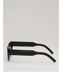 Side view of sleek black cat-eye sunglasses featuring wide temples and glossy finish