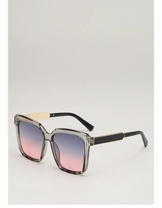 Detail of square oversized sunglasses with gradient lenses and gold arrow metal accents