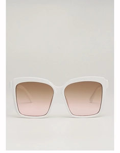 Detail view of large square white frames with brown-to-pink gradient lenses sunglasses