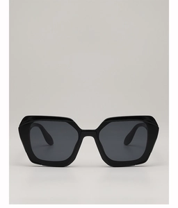 Front view of bold black geometric sunglasses featuring thick frames and dark grey lenses