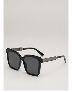 Detail of black oversized square sunglasses with stylish grey metal temple accents