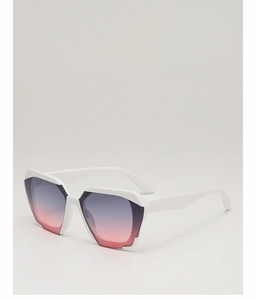 Detail view of bold white geometric sunglasses with grey-pink gradient lenses