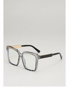 Detail of square oversized sunglasses with grey frame and gold metal hinges