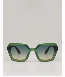 Macro detail of green translucent geometric sunglasses frame with tortoiseshell temples