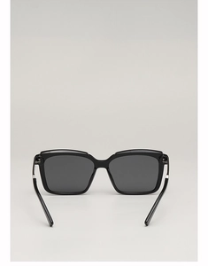 Detailed close-up showing the glossy black resin texture and square frame of these sunglasses
