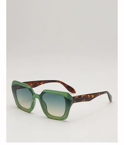 Close-up of green polygon sunglasses with gradient lenses and leopard print temples