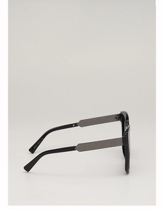 Detail view of large black square sunglasses frame with M6184 model text on temple