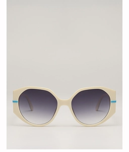 Detail of round cream sunglasses featuring blue accents and gradient purple lenses