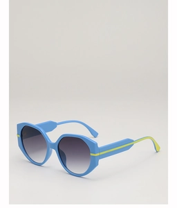 Detail view of round light blue sunglasses with yellow accents and grey gradient lenses
