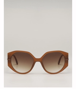 Detailed macro view of geometric brown translucent frames and gradient lenses of sunglasses