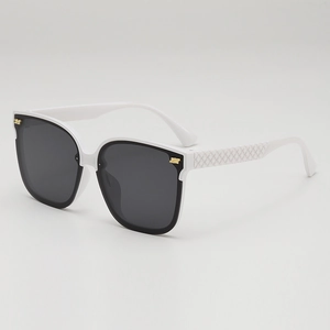 Chic oversized square sunglasses with white frames, black lenses, and quilted temples
