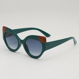 Retro cat-eye sunglasses with dark green frame and reddish-brown contrast details