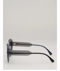 Side view of full-rim round sunglasses with geometric translucent grey frames