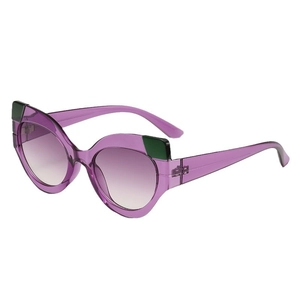 Fashionable cat eye sunglasses with purple translucent frames and green accents