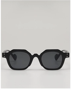 Detail of black geometric sunglasses with silver rivets and heart-shaped temple tip