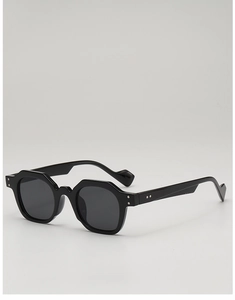 Detail of vintage black geometric sunglasses with thick frames and metal rivets