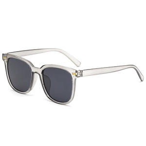 Grey translucent square sunglasses with dark lenses and gold metal accents on temples