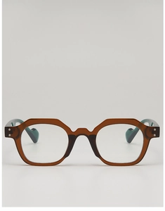 Close-up of vintage geometric sunglasses frame with amber tortoiseshell and silver rivets