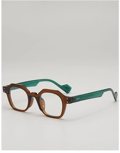 Detail of irregular polygon sunglasses with brown frames and green temples