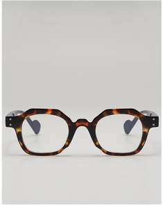 Detail of tortoise shell irregular geometric frame with silver rivet ornaments