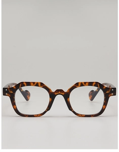 Detailed view of polygon tortoiseshell frames with a vintage geometric eyewear design