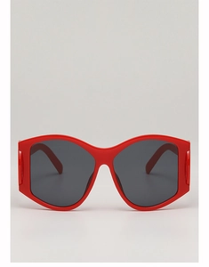 Front view of oversized punk-style sunglasses with glossy red frames and dark grey lenses