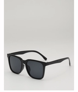 Close-up of black square frame sunglasses with dark grey lenses on a grey background