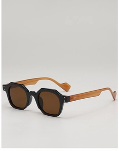 Detail of geometric retro sunglasses with tortoiseshell temples and silver rivet accents