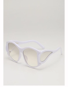 Close-up of white oversized sunglasses featuring unique wing-shaped cutout decor details