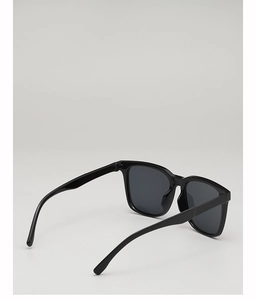Rear view detail of black square sunglasses with dark grey UV lenses and integrated nose pads
