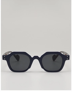 Front view of dark blue polygonal sunglasses with silver studs and grey lenses