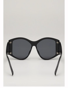 Detail showing the durable silver metal hinges on large black oversized sunglasses