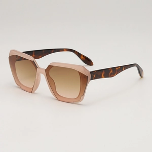 Retro polygon sunglasses with pink transparent frames and brown gradient lenses