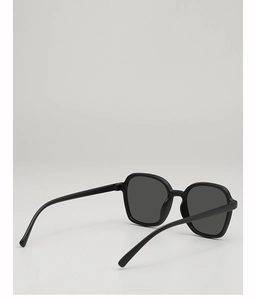 Detailed back view of sleek black frame kids sunglasses with UV protective dark lenses