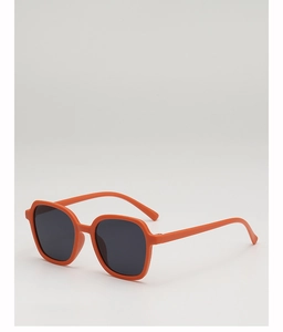 Detail of orange square round children sunglasses with matte finish and dark grey lenses