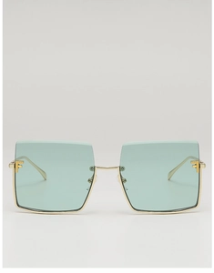 Detailed view of square rimless sunglasses with green lenses and gold F-shaped metal hinge